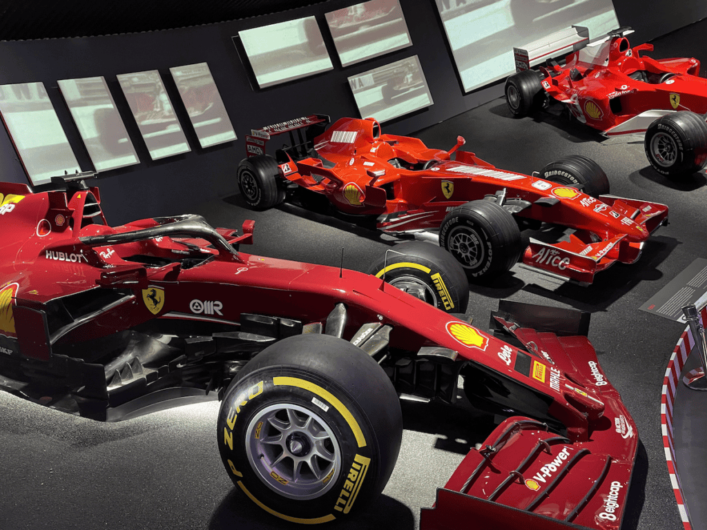 multiple red ferrari f1 cars